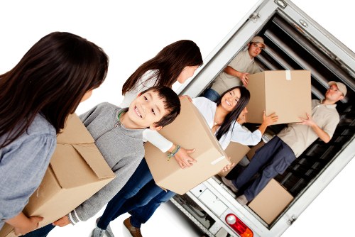 Man with a van loading furniture in Friern Barnet