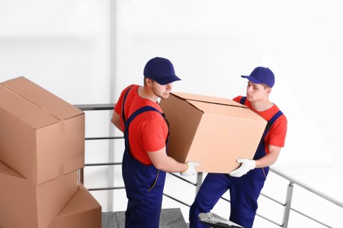 Removals van and moving team outside a home in Friernbarnet