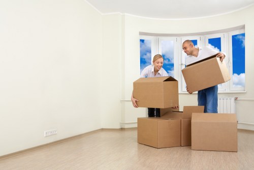 Professional movers handling household items during a Friern Barnet relocation