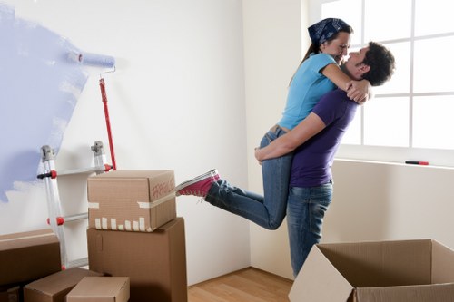 Packed business boxes and office furniture ready for transport