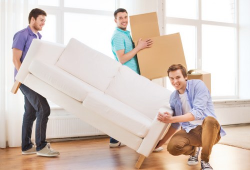 Packed moving boxes and furniture ready for transport in North London