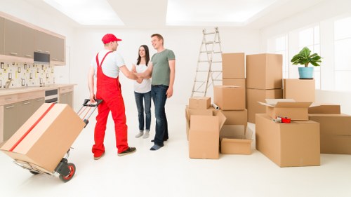 Careful wrapping of fragile household items during a local packing service
