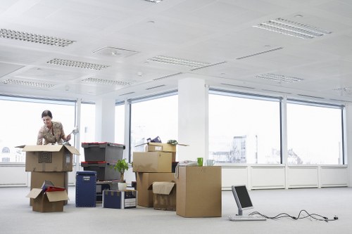 Movers carrying household items through a residential property