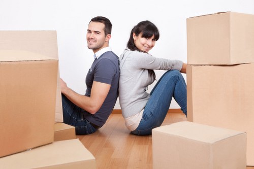 Local commercial movers handling equipment in a North London premises